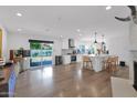 Open-concept living space with wood floors, a gourmet kitchen, and sliding glass doors to the backyard at 8582 E Via De Dorado --, Scottsdale, AZ 85258