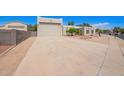 Spacious driveway leading to a stylish single Gathering home with an attached two-car garage at 1018 E Knoll St, Mesa, AZ 85203