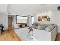 Comfortable living room features a projector screen and wall art for a cozy entertainment space at 110 W Missouri Ave # 18, Phoenix, AZ 85013