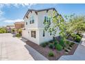 Angle shot of the exterior highlighting a garage and beautiful curb appeal with tasteful landscaping and modern architecture at 1151 S Avoca --, Mesa, AZ 85208