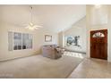 Bright living room with lots of natural light and neutral carpeting and tile flooring at 11805 N 90Th Way, Scottsdale, AZ 85260