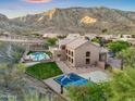Aerial view of a luxurious backyard with pool, sports court, and lush landscaping at 14049 S 8Th St, Phoenix, AZ 85048