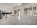 Bright kitchen featuring white cabinets, an island, and stainless steel appliances at 14470 N 98Th Pl, Scottsdale, AZ 85260
