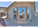 Home's exterior featuring large windows offering natural light, plus desert landscaping at 1855 N Rim Rock Dr, Casa Grande, AZ 85122