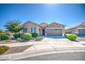 Beautiful single-story home featuring stone accents, a three-car garage, and well-maintained landscaping at 21551 E Waverly Ct, Queen Creek, AZ 85142