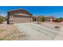 Charming single-Gathering home with a large two-car driveway and desert landscaping at 22544 W Mohave St, Buckeye, AZ 85326