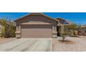 Charming single-Gathering home displaying a two-car garage with stone veneer accents at 22544 W Mohave St, Buckeye, AZ 85326