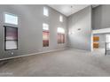 Bright and spacious living room boasts tall ceilings, lots of windows, and neutral tones at 2306 W Spur Dr, Phoenix, AZ 85085