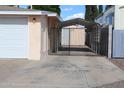 A spacious covered carport adjacent to the garage offers ample parking and protection at 235 N 61St Pl, Mesa, AZ 85205