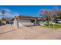 Single-story home features an attached garage, spacious driveway, and low maintenance landscaping at 3408 W Carol Ave, Phoenix, AZ 85051