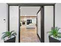 View of the open-concept living room and fireplace through front door at 3615 E Charter Oak Rd, Phoenix, AZ 85032