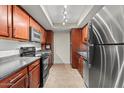 Modern kitchen featuring stainless steel appliances, and sleek countertops at 3825 E Camelback Rd # 117, Phoenix, AZ 85018