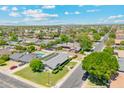 Expansive aerial view of a residential neighborhood with lush green landscaping and sparkling pools at 400 N Jay N St, Chandler, AZ 85225