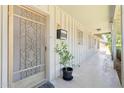 Inviting front porch with decorative security door, mailbox and potted plant at 400 N Jay N St, Chandler, AZ 85225