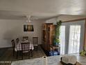 Cozy dining area featuring a wooden dining set and plenty of natural light at 4614 N 19 Ave, Phoenix, AZ 85015