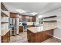 Beautiful kitchen with granite countertops, stainless steel appliances, and wooden cabinets at 4808 W Shaw Butte Dr, Glendale, AZ 85304