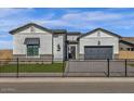 Charming exterior with manicured lawn and dark metal fencing adding to its appeal at 5749 E Sanford St, Mesa, AZ 85215