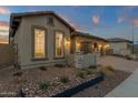 The house showcases decorative rock landscaping with planter boxes along its facade at 5756 E Star Valley St, Mesa, AZ 85215