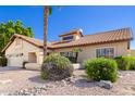 Charming single Gathering home with desert landscaping and a two car garage at 6122 E Saddleback St, Mesa, AZ 85215