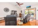 Comfortable living room with tile floors, furniture and access to patio with pool at 6122 E Saddleback St, Mesa, AZ 85215