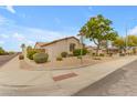 Corner lot home in Arizona with low maintenance desert landscaping including gravel and bushes at 6870 S Justin Way, Chandler, AZ 85249