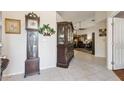 Spacious entryway with tiled floors, decorative furnishings, and access to living areas at 7457 W Crystal Rd, Glendale, AZ 85308