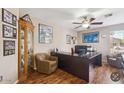 Functional office with ample desk space, comfortable seating, and natural light at 7457 W Crystal Rd, Glendale, AZ 85308