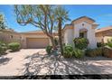 Beautiful home with a two-car garage, lush landscaping, and a well-manicured lawn at 7705 E Doubletree Ranch Rd # 8, Scottsdale, AZ 85258
