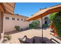 Inviting outdoor patio area, with comfortable seating under a large sun umbrella at 7705 E Doubletree Ranch Rd # 8, Scottsdale, AZ 85258