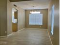 Bright dining room with large window providing natural light and tile floors at 8732 W Adam Ave, Peoria, AZ 85382
