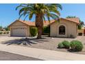 Inviting single-story home featuring a terracotta roof and low-maintenance landscaping at 9123 W Utopia Rd, Peoria, AZ 85382
