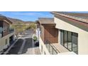 Modern home exterior featuring a balcony, sleek lines, and desert landscaping in a serene neighborhood at 1 Easy St # 4, Carefree, AZ 85377