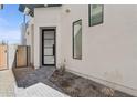 Inviting front entrance with a modern door, clean lines, xeriscape yard, and a well-maintained pathway at 1 Easy St # 5, Carefree, AZ 85377