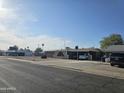 Single-story home with a carport, desert landscaping, and neutral-colored facade at 1904 E Jarvis Ave, Mesa, AZ 85204