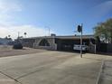 Single-story home with a carport, desert landscaping, and front yard basketball hoop at 1904 E Jarvis Ave, Mesa, AZ 85204