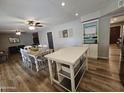 Open-concept kitchen and dining area featuring a central island, modern cabinetry, and a spacious layout at 1904 E Jarvis Ave, Mesa, AZ 85204
