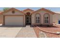 Charming single-story home with a well-maintained front yard and covered entryway at 1917 E Lindrick Dr, Chandler, AZ 85249