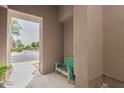 Inviting entrance with a quaint wooden bench, offering a welcoming curb appeal at 19550 N Grayhawk Dr # 2023, Scottsdale, AZ 85255
