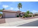 Well-maintained home with desert landscaping, a tile roof, and an attached garage at 20039 N Hearthstone Dr, Surprise, AZ 85374