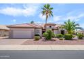 Single-story home with desert landscaping, large palm trees, and a neutral color scheme at 20039 N Hearthstone Dr, Surprise, AZ 85374