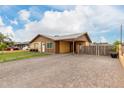 A charming single-story home features an inviting front patio and a convenient covered carport at 2132 W Chambers St, Phoenix, AZ 85041
