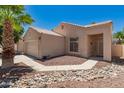 Charming home with desert landscaping, complemented by a two-car garage and easy access to the front door at 2922 N 107Th Dr, Avondale, AZ 85392