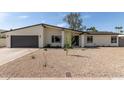 Charming single-story home featuring a low maintenance desert landscape and a large two car garage at 3752 W Becker Ln, Phoenix, AZ 85029