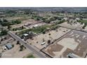 This aerial view shows the large lot in a neighborhood with mature trees and homes nearby at 40458 N Prince Ave, San Tan Valley, AZ 85140