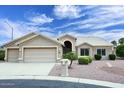 Charming single-story home boasts a three-car garage and well-maintained desert landscaping at 4081 N 156Th Dr, Goodyear, AZ 85395