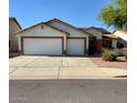 Inviting single-story home featuring a spacious two-car garage and low-maintenance landscaping on a sunny day at 15742 W Central St, Surprise, AZ 85374