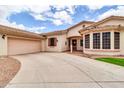 Stunning home showcases a spacious driveway, attached garage, and tiled roof at 20423 S 186Th St, Queen Creek, AZ 85142