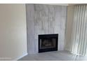 Living room features a fireplace and tile flooring at 2100 W Lemon Tree Pl # 29, Chandler, AZ 85224