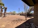 Large backyard featuring mature trees and plenty of space for outdoor activities and relaxation at 2134 E Harvard St, Phoenix, AZ 85006