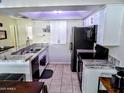 Well-lit kitchen equipped with modern appliances, spacious countertops, and ample cabinet space at 2927 N Oregon St # 7, Chandler, AZ 85225